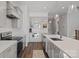 Modern kitchen featuring stainless appliances, white cabinets and a center island with barstool seating at 4532 Stellata Loop, Sherrills Ford, NC 28673