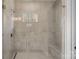 Contemporary tile shower features glass enclosure, integrated bench, and window at 4532 Stellata Loop, Sherrills Ford, NC 28673
