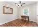 Bedroom with wood floors, window, and chair with desk at 4915 Galax Dr, Charlotte, NC 28213