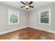 Bedroom with hardwood floors, neutral walls, and a ceiling fan at 4915 Galax Dr, Charlotte, NC 28213