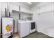 Laundry room with a washer, dryer, and shelving units at 4915 Galax Dr, Charlotte, NC 28213