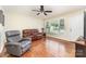 Spacious living room featuring hardwood floors, a ceiling fan, and plenty of natural light at 4915 Galax Dr, Charlotte, NC 28213