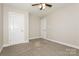Cozy bedroom with neutral carpeting, abundant natural light, and ample closet space at 507 E Cloninger St, Dallas, NC 28034
