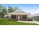 Charming brick home with a inviting front porch and a well-manicured lawn at 507 E Cloninger St, Dallas, NC 28034