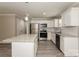 Well-lit kitchen showcasing stainless steel appliances, granite countertops, and modern fixtures at 507 E Cloninger St, Dallas, NC 28034