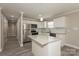 Contemporary kitchen with granite countertops, stainless steel appliances, and island workspace at 507 E Cloninger St, Dallas, NC 28034