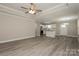 Bright, open living space featuring modern flooring and a seamless flow to the kitchen at 507 E Cloninger St, Dallas, NC 28034
