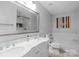 Bright bathroom features a double sink vanity, a jacuzzi tub and tiled shower at 507 Galesburg Dr, Monroe, NC 28110