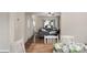Open concept featuring the living room with a leather sofa, table, and lots of natural light at 507 Galesburg Dr, Monroe, NC 28110