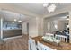 Open concept dining room and kitchen with luxury vinyl plank flooring and modern lighting at 507 Galesburg Dr, Monroe, NC 28110