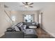 Inviting living room featuring hardwood floors, a leather sectional sofa, and plenty of natural light at 507 Galesburg Dr, Monroe, NC 28110