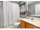 Clean bathroom featuring a shower with curtain, vanity with sink, and decorative art at 5402 Harris Cove Dr, Charlotte, NC 28269