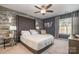 Stylish bedroom features a statement headboard, modern furnishings, and a comfortable chaise lounge at 5402 Harris Cove Dr, Charlotte, NC 28269