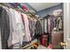 Walk-in closet with ample hanging storage and organization, providing a tidy space for clothing at 5402 Harris Cove Dr, Charlotte, NC 28269