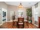 Bright dining room with wood floors, natural light, and seamless access to the living room and other areas at 5402 Harris Cove Dr, Charlotte, NC 28269