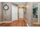 Inviting entryway featuring warm wood floors, neutral paint colors, and direct access to other rooms at 5402 Harris Cove Dr, Charlotte, NC 28269