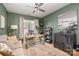 Inviting home office featuring a cozy sofa, desk, natural light, and stylish decor at 5402 Harris Cove Dr, Charlotte, NC 28269