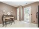 Open kitchen area with bar seating, ample lighting, and access to the outdoor patio for easy entertaining at 5402 Harris Cove Dr, Charlotte, NC 28269