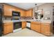 Bright kitchen with wooden cabinetry, white countertops, and modern appliances for cooking and entertaining at 5402 Harris Cove Dr, Charlotte, NC 28269
