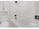 Bright white bathroom with a shower and tub, plus sleek fixtures at 6504 Sybil Ct, Indian Trail, NC 28079