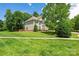 Charming two-story home featuring a manicured lawn and mature trees, exuding curb appeal at 6504 Sybil Ct, Indian Trail, NC 28079