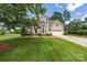 Charming two-story home with manicured lawn, attached two-car garage and classic colonial-style shutters and trim at 6504 Sybil Ct, Indian Trail, NC 28079