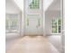 Bright foyer with hardwood flooring, soaring ceilings, and transom windows at 6504 Sybil Ct, Indian Trail, NC 28079
