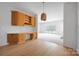 Open-concept living room with fireplace, hardwood floors, and bright natural light at 6504 Sybil Ct, Indian Trail, NC 28079