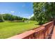 Picturesque view of a tranquil pond with lush greenery, captured from the home's private deck space at 6504 Sybil Ct, Indian Trail, NC 28079