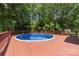 Inviting backyard pool surrounded by wooden deck, offering a private outdoor retreat and relaxation space at 6504 Sybil Ct, Indian Trail, NC 28079