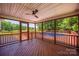Cozy screened porch with wooded views, ceiling fan, and deck access for relaxing outdoor living at 6504 Sybil Ct, Indian Trail, NC 28079