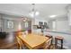 Open-concept dining area flowing into the living room and kitchen at 8014 Sherington Way, Charlotte, NC 28227