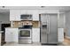 Bright kitchen has stainless steel appliances and granite countertops at 8014 Sherington Way, Charlotte, NC 28227