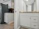 Kitchenette next to bathroom with stainless steel appliances and granite countertops at 8014 Sherington Way, Charlotte, NC 28227