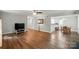 Open-concept layout featuring hardwood floors and views into the kitchen at 8014 Sherington Way, Charlotte, NC 28227