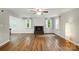 Spacious living room featuring a cozy fireplace and abundant natural light at 8014 Sherington Way, Charlotte, NC 28227