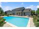 Backyard featuring a pool, hot tub, lounge area, and manicured lawn at 837 Tyne Dr, Fort Mill, SC 29715