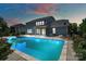 Backyard at dusk featuring a pool, patio, and exterior home view at 837 Tyne Dr, Fort Mill, SC 29715