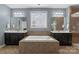 This bathroom features dual vanities, a soaking tub, and a glass-enclosed shower at 837 Tyne Dr, Fort Mill, SC 29715