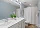 Bright bathroom with double sinks, framed mirror, and shower with curtain at 837 Tyne Dr, Fort Mill, SC 29715