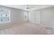 Bright bedroom with neutral paint, plush carpet, and double hung windows at 837 Tyne Dr, Fort Mill, SC 29715