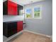 Small bedroom with red and black shelving and a double hung window at 837 Tyne Dr, Fort Mill, SC 29715