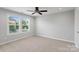 Bright bedroom with neutral paint, plush carpet, and double hung windows at 837 Tyne Dr, Fort Mill, SC 29715