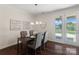 Bright dining area featuring modern lighting and access to a patio and pool at 837 Tyne Dr, Fort Mill, SC 29715