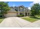 Lovely two-story home with a brick facade, well-manicured lawn and a two car garage at 837 Tyne Dr, Fort Mill, SC 29715
