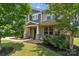 Attractive front facade featuring manicured landscaping, and a covered entryway at 837 Tyne Dr, Fort Mill, SC 29715