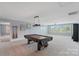 Bright game room with pool table, neutral paint, large windows, and plush carpet at 837 Tyne Dr, Fort Mill, SC 29715