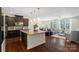 Open-concept kitchen with stainless steel appliances, island and seamless connection to the living and dining areas at 837 Tyne Dr, Fort Mill, SC 29715