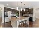 Gourmet kitchen with granite countertops, stainless steel appliances, and center island with seating at 837 Tyne Dr, Fort Mill, SC 29715