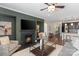 Bright and inviting living room featuring fireplace, ceiling fan, and open floor plan at 837 Tyne Dr, Fort Mill, SC 29715